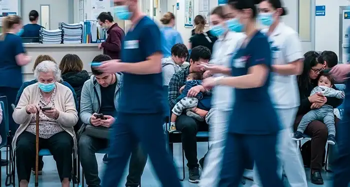Sick patients with respiratory illnesses wait in the hospital waiting room.